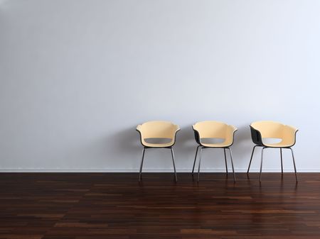Three Chairs to  face a blank wallの写真素材