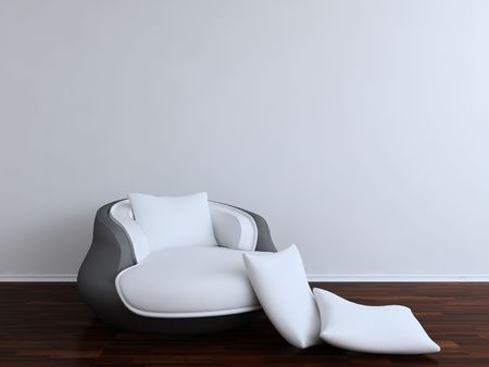 Divan Chair with white cushion - to face a blank white wallの写真素材