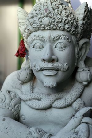 Ancient Balinese statue chasing the evil spirits