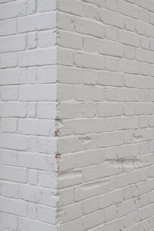 Close up shot of a white texture wall at a angleの写真素材