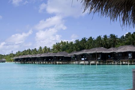 A row of beautiful beach water villa in maldivesのeditorial素材