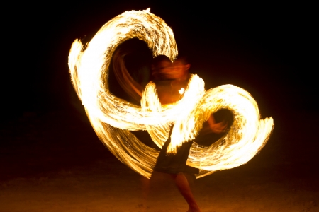 Photo of an amazing fire performance at night on Koh Tao Island, Thailandの写真素材