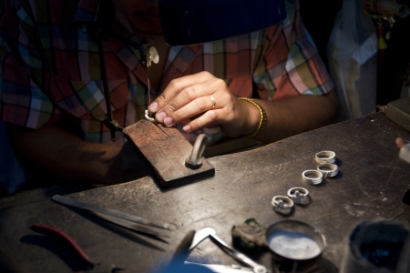 Close up shot of the making of silver jewelry.の写真素材
