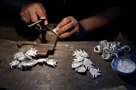 Close up shot of the making of silver jewelry.の写真素材