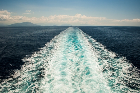 A trail of the large ship seen from the sternの写真素材