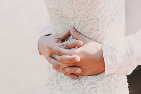 pregnant woman holding her bellyの写真素材
