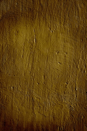 Closeup of a rough wall in a warm brown color.の写真素材