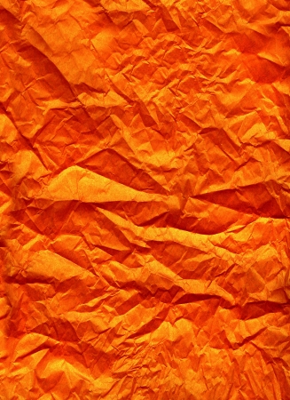 Wrinkled orange silk paper background textureの写真素材