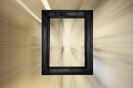 Black old wooden frame on bright futuristic motion backgroundの写真素材