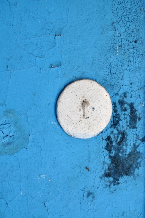 Old light switch on peeling wall, の写真素材
