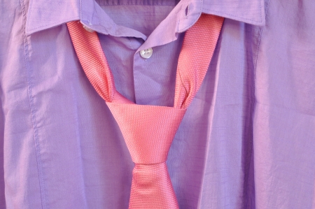 Closeup of purple shirt with pink necktie