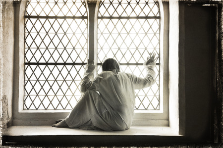 Desperate woman at a psychiatric ward, grungy style の写真素材