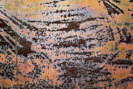 Closeup of old corroded metal with patterns and colors.
