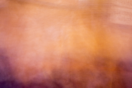 Colorful, smooth sandstone wall in yellow, pink, and purpleの写真素材