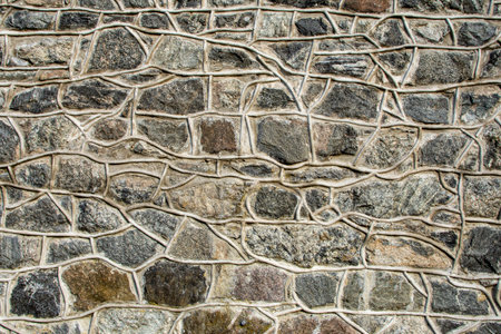 Closeup of ancient stonewall in brown and gray