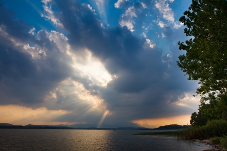 lake with cloudy blue skyの写真素材