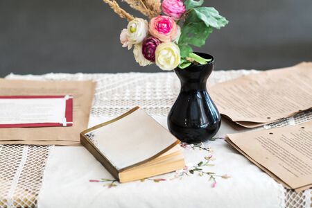 still life with roses and bookの写真素材