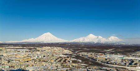 view of the city and volcano from hill near cityの写真素材
