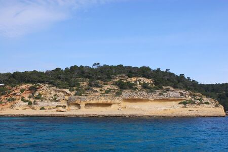 Sand beach and rock shore in Spainの写真素材