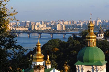 Church with green-gold doom in Ukraine where river streamsの写真素材