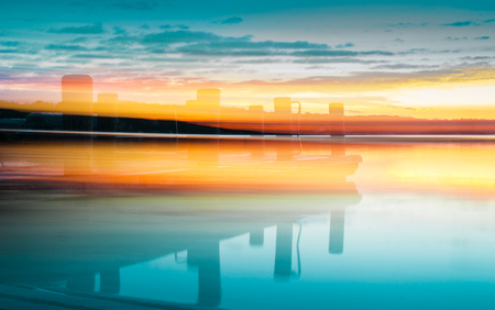 Artistic Background with Boat Dock, Clouds, Horizon, and Sunriseの写真素材