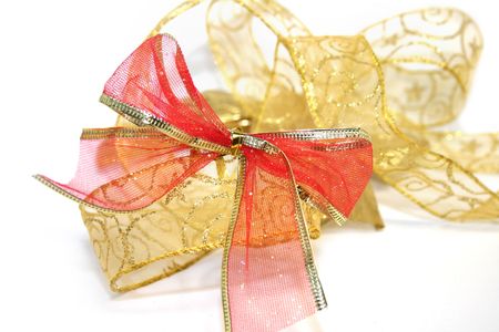 golden ribbon over the white backgroundの写真素材