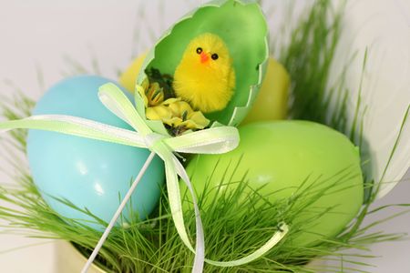Colored easter eggs in a grass