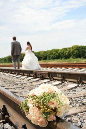 Bride's bouquet . wedding couple on the background.の写真素材