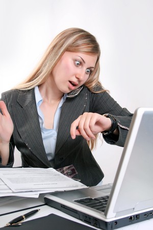 Young smiling business woman working with laptopの写真素材