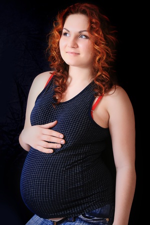 beautiful pregnant woman expecting a baby girlの写真素材