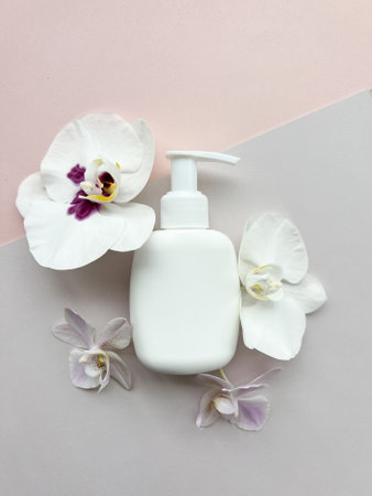 Packaging for cosmetic products with orchid flowers.の写真素材