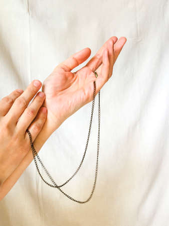 Cropped image of woman touching handの写真素材