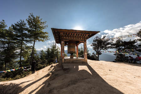 A Buddhistic prayer drum in the mountains of Buthan. The translation of the  symbols on the drum are prosperity, holiness and the mantra of Buddhism or the the teachings of buddhismの写真素材