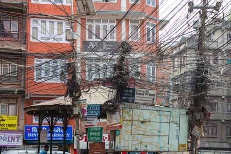 Kathmandu, Nepal - September 12, 2020: Electrical wire on the roads of Kathmandu. Chaotic cable laying for the electrical supply of the capital of Nepal. Electricity interruption are commonplaceのeditorial素材