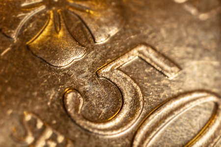 macro close up of 50 Malaysian ringgit cents. The bank negara fifty cent coin of Malaysia. Sharp detailed capture of the Malaysia character on the RM 50 sen coin. microscopic picture of this coinの写真素材