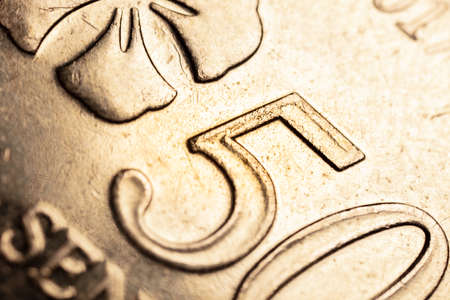 macro close up of 50 Malaysian ringgit cents. The bank negara fifty cent coin of Malaysia. Sharp...