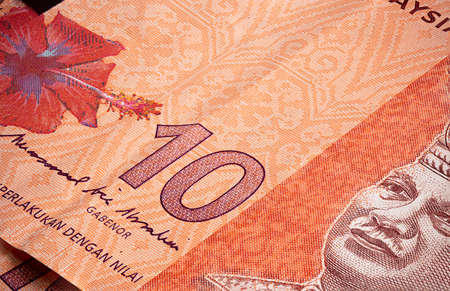Macro close up of 10 Malaysian Ringgit. Extreme close up of RM10 Malaysia. Portrait of the first...