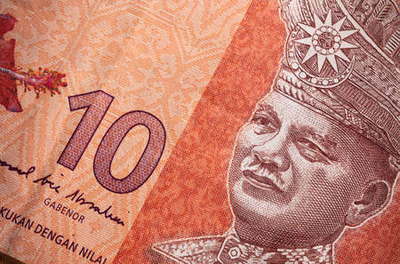 Macro close up of 10 Malaysian Ringgit. Extreme close up of RM10 Malaysia. Portrait of the first King or Agong of Malaysia. Paper currency closeupの写真素材