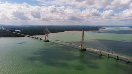 Aerial photography of the Johor Bridge at the south of Malaysia - Malaysia captured from the sky. Huge bridge near by Singapore. Masterful construction over the ocean bay close to Desaru coastのeditorial素材