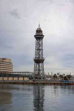 Barcelona, Spain - September 21, 2021: The Torre de Jaumei Tower in the Marina Rambla de Mar. Part of the cable car in Port Vell, a major attraction of the vibrant modern Catalan metropolis.のeditorial素材