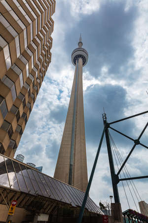 Toronto, Canada - August 26, 2021: The Canadian National tower or CN tower in the Canadian metropolis, landmark of Ontario city. A concrete communications and observation tower in downtown Torontoのeditorial素材
