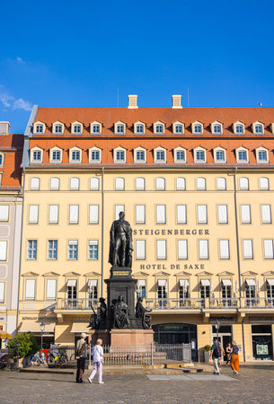 Dresden, Germany - June 28, 2022: The famous Steigenberger Hotel de Saxe at Neumarkt in the old town of Dresden. In front the Statue of Friedrich August II. Grand Hotel with the Saxony King in frontのeditorial素材