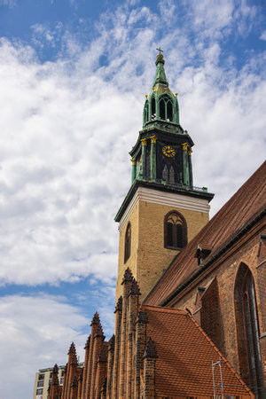 Berlin, Germany - June 29, 2022: The St. Marienkirche or St. Mary's Church near the Alexanderplatz beside the TV tower. The oldest church in Berlin is built mainly of granite. Roman Catholic churchのeditorial素材