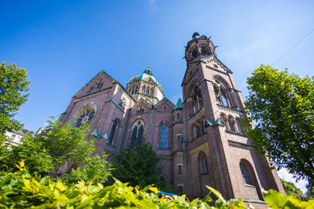 Munich, Germany - July 6, 2022: St. Luke's Church (German: St. Lukas or Lukaskirche). Located on the banks of the Isar, between the SteinsdorfstraÃe and Mariannenplatz. Wide angle view to the churchのeditorial素材