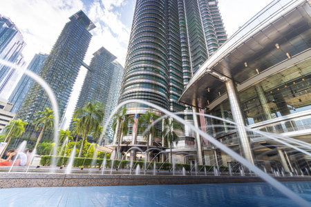 Kuala Lumpur, Malaysia - August 13, 2022: The KLCC Park with the water fountain show in front of the...