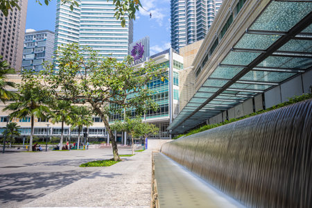 Kuala Lumpur, Malaysia - August 13, 2022: KLCC Park with the water fountain show in front of the...