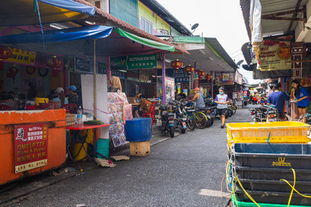 Pulau Ketam, Malaysia - December 26, 2022: Pulau Ketam translated means crab island, It is a small island located off the coast of Klang. Street view of the fisher man village built entirely on stiltsのeditorial素材