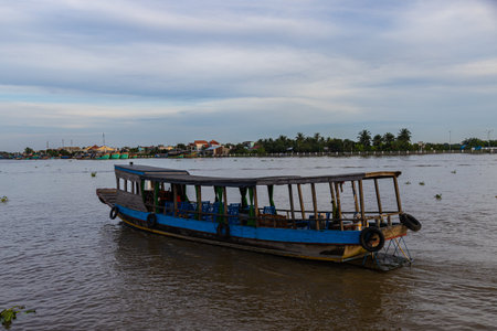 Ho Chi Minh City, Vietnam- November 9, 2022: Tourist boat at the river bank of the Mekong river at the Mekong Delta near Saigon. The Delta and Ho Chi Minh City is a famous travel destinationのeditorial素材