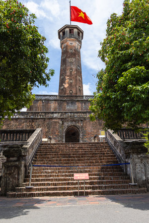 Hanoi, Vietnam - May 28, 2023: Vietnam Military History Museum and the Hanoi flag tower. 33 meters high tower features three tiers and a pyramidal peak with the large national flag on a flag pole.のeditorial素材
