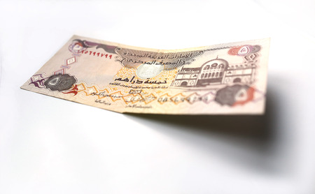 United Arab Emirates Dirham currency on white background
